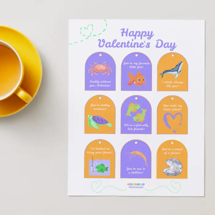 Valentine's Day card with cartoon animal tags and a cup of tea on a light surface.